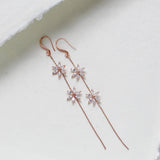 Long thin gold earrings with simulated diamond flowers - RAELYNN - Treasures by Agnes