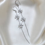 Long thin gold earrings with simulated diamond flowers - RAELYNN - Treasures by Agnes