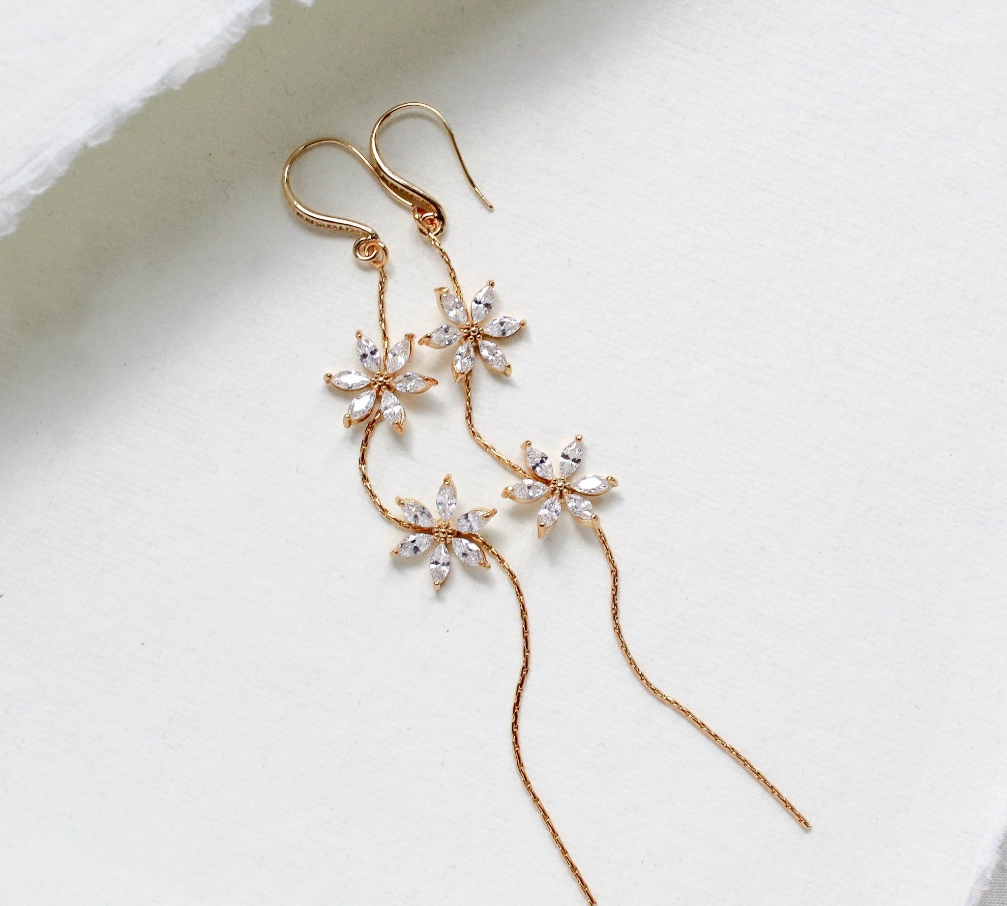 Long thin gold earrings with simulated diamond flowers - RAELYNN - Treasures by Agnes