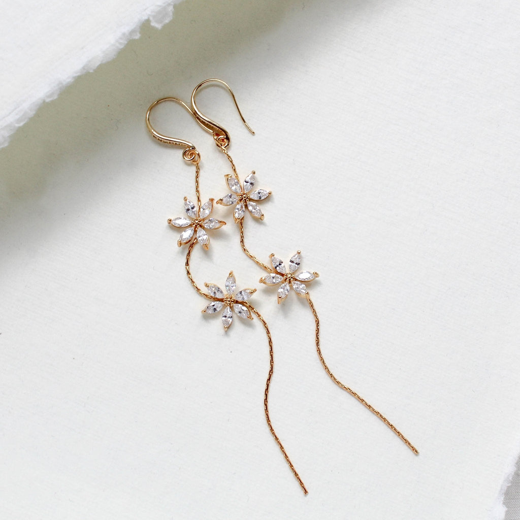 Long thin gold earrings with simulated diamond flowers - RAELYNN - Treasures by Agnes