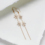 Long thin gold earrings with simulated diamond flowers - RAELYNN - Treasures by Agnes