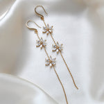 Long thin gold earrings with simulated diamond flowers - RAELYNN - Treasures by Agnes