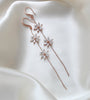 Long thin gold earrings with simulated diamond flowers - RAELYNN - Treasures by Agnes