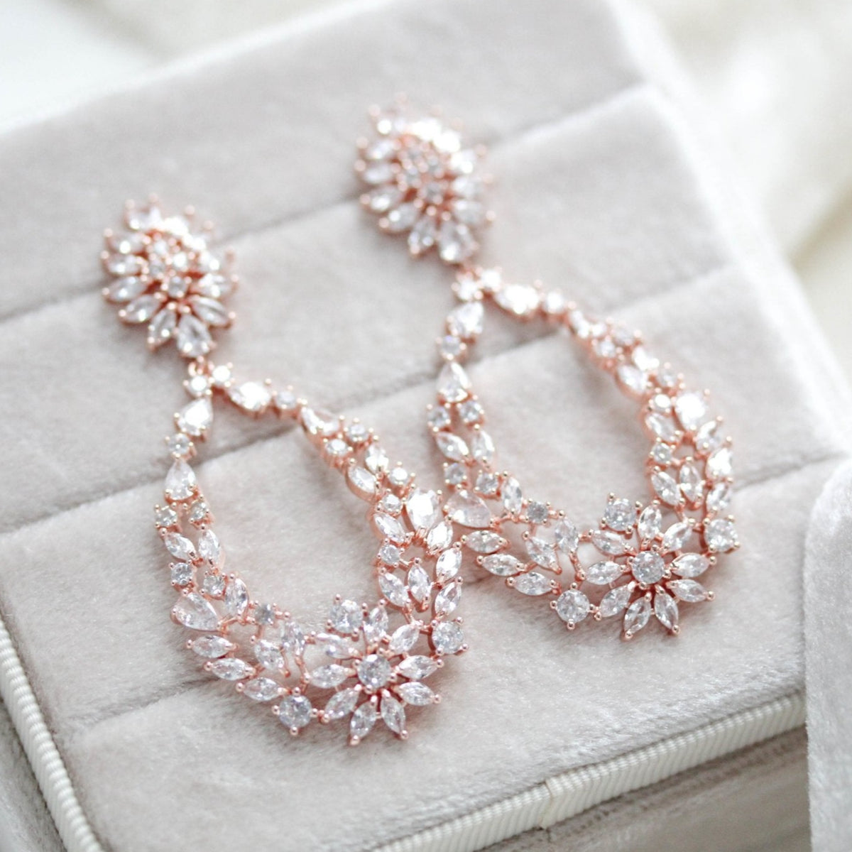 Celestia Crystal Bridal Earrings in Rose Gold | Model Chic